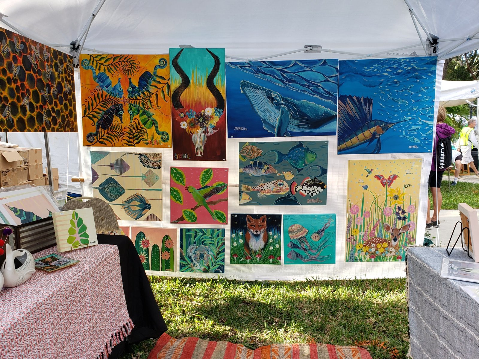 Art exhibition booth with colorful paintings